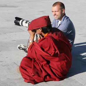 Jay teaching photography to a Buddhist monk in Tibet